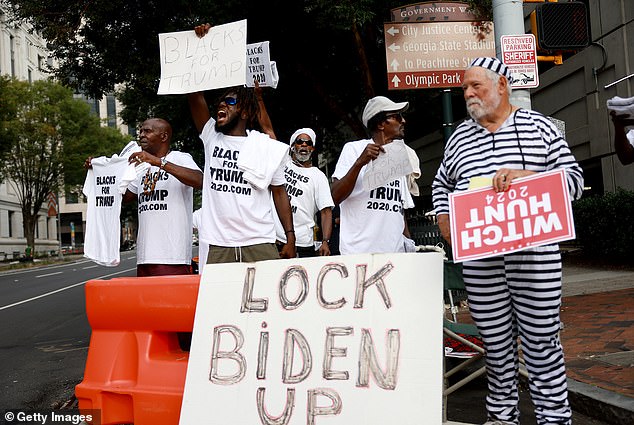 'Blacks for Trump' protesters show their support for Trump and his 18 co-defendants outside the Fulton County Courthouse on September 6, 2023 in Atlanta, Georgia.