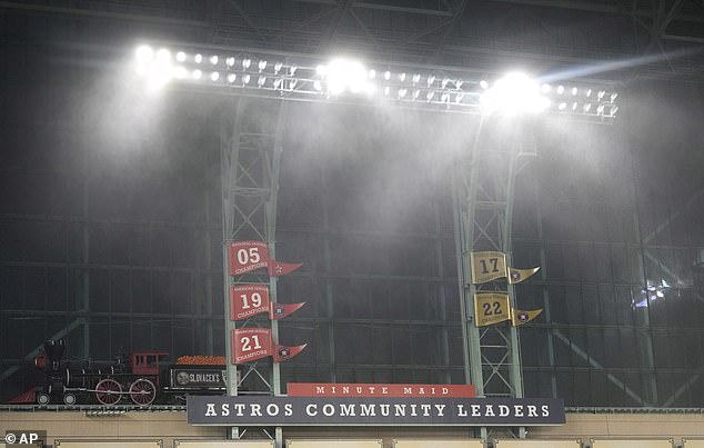 Rain pours through the windows as a strong storm hits before a baseball game between the Oakland Athletics and the Houston Astros at Minute Maid Park.