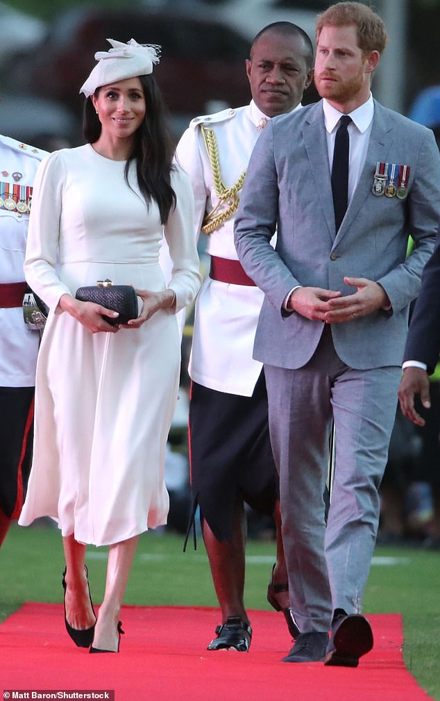 This ivory Zimmermann dress topped with a Stephen Jones headpiece made Meghan look like the modern bride.