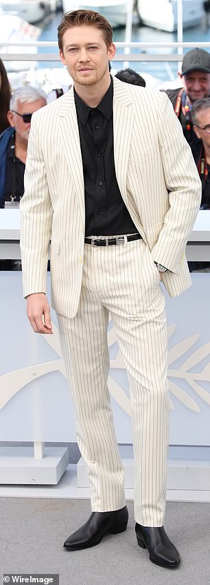 Joe Alwyn looked very dapper as he opted for a summery cream striped suit.