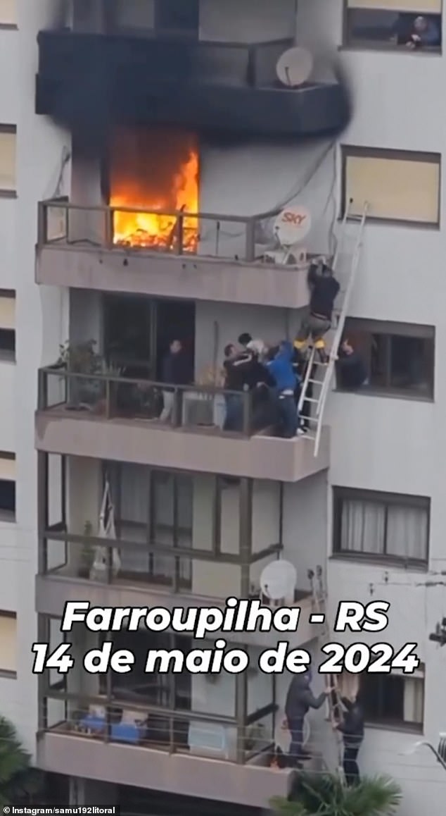 A team of rescuers swings ladders on balcony ledges to reach the boy and take him to safety. She suffered minor burns