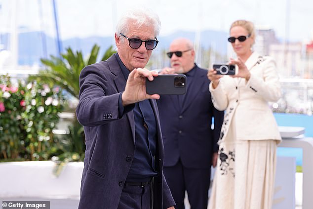 Uma and Paul posed for a selfie taken by Richard before Uma whipped out her own phone again to take one too.