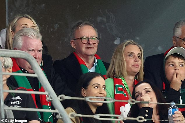 Anthony Albanese (centre) is pictured wearing a scarf from his beloved Bunnies at the Penrith Panthers v South Sydney Rabbitohs match at Accor Stadium on September 24, 2022.