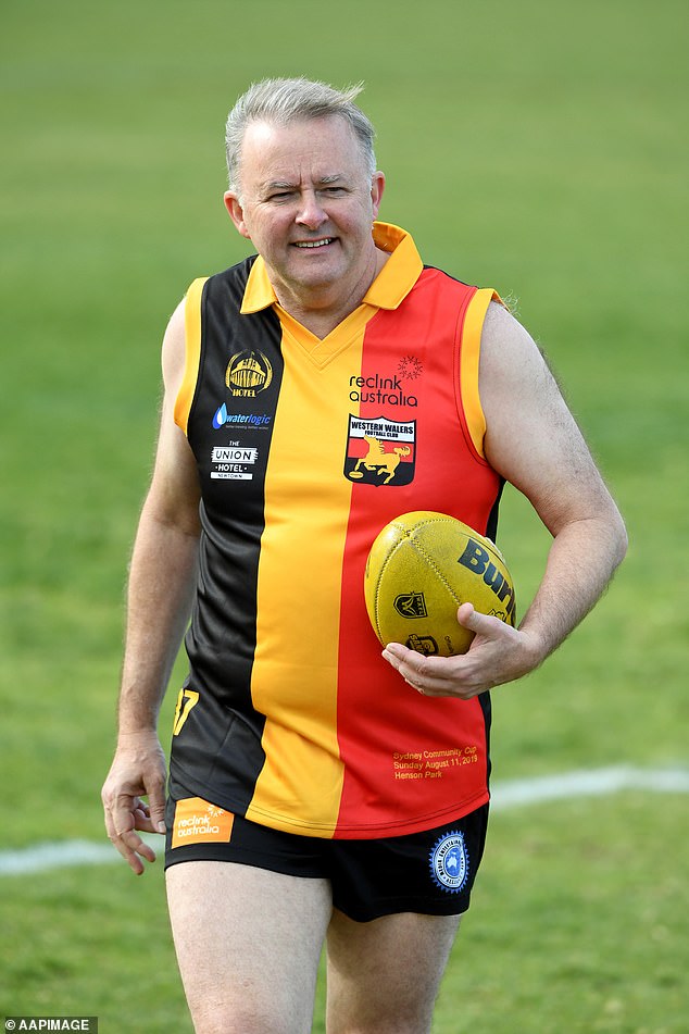 The Prime Minister has a long history of donning the scarves, and sometimes the entire set, of sports equipment over the years. He is shown warming up during the annual AFL Reclink Community Cup match at Henson Park in Marrickville, Sydney on Sunday 11 August 2019.