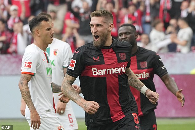 Robert Andrich (pictured) doubled Leverkusen's lead, who held on in the second half to continue their unbeaten run.