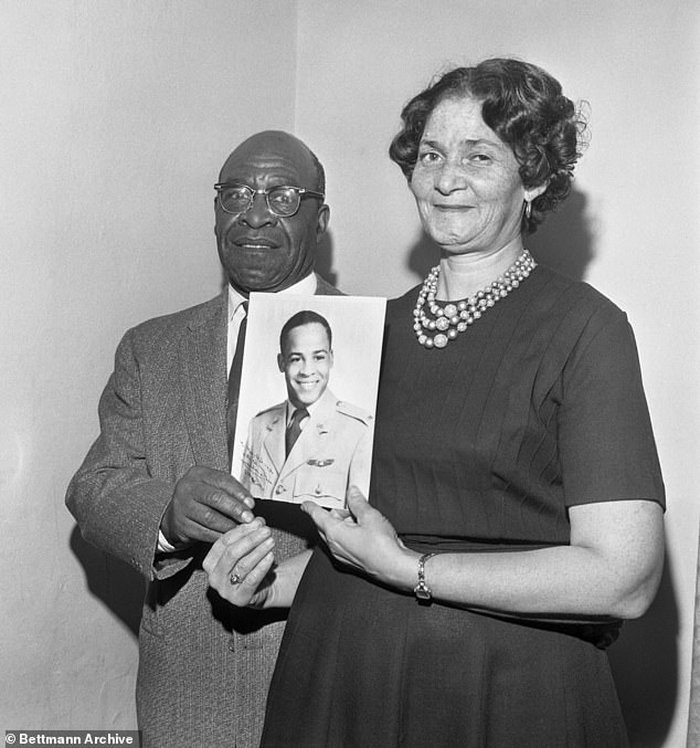 Pictured: Mr. and Mrs. Edward Dwight Sr. hold a photograph of their son, Edward Dwight Jr., who has been the first African American selected as a potential astronaut.