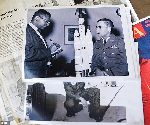 Pictured: Images and news clips Dwight saved from his time as an astronaut in his studio in Denver, Colorado.