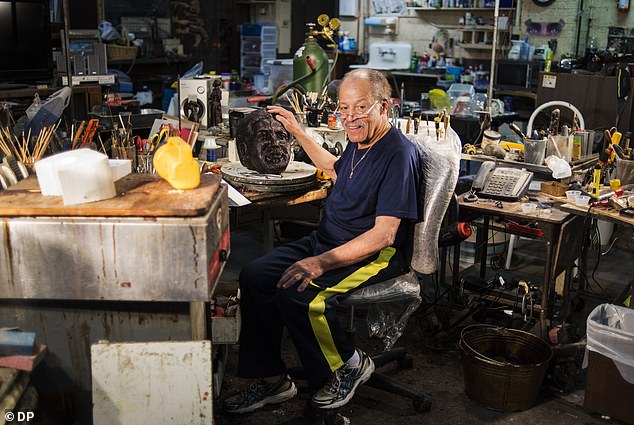 Pictured: Dwight poses for a portrait in his sculpting workspace at his studio in Denver, Colorado.