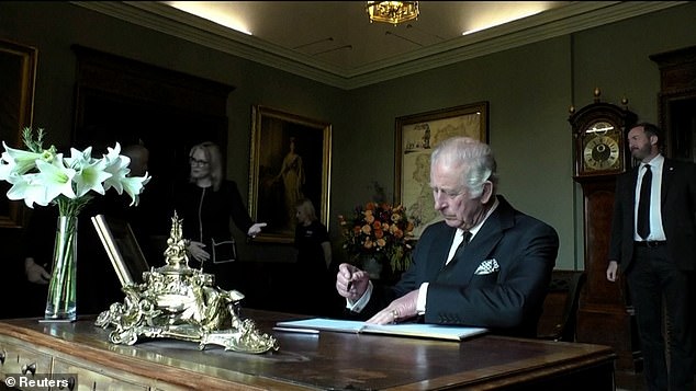 Camilla was seen calming the situation as the King appeared upset over a pen.