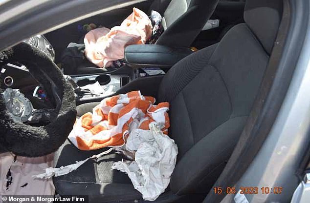 This photo shows the aftermath of the accident with the airbag module exploded and the airbag shattered in the seat.