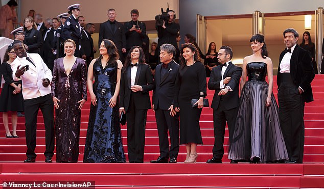 Jury president Greta Gerwig, second from left, poses with jury members Omar Sy, from left, Lily Gladstone, Nadine Labaki, Kore-eda Hirokazu, Ebru Ceylan, JA Bayona, Eva Green and Pierfrancesco Favino at the inaugural festival.