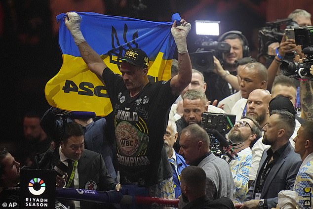 After being crowned the new undisputed champion, Usyk stood against the ropes and raised a Ukrainian flag.