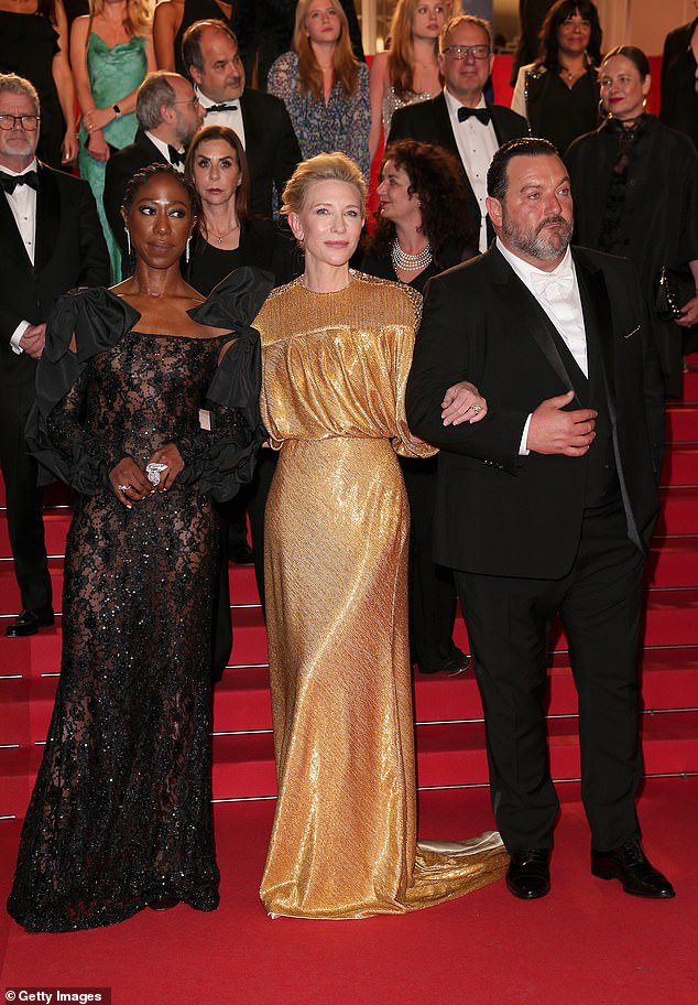 Denis Ménochet, 47 (right), also looked dapper in a black tuxedo as he took the opportunity to take several photos with his co-stars.