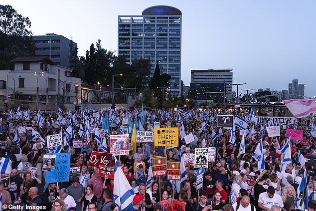 Protesters in Tel Aviv on Saturday night. Netanyahu's critics, including thousands of people who have joined weekly protests in recent months, accuse him of prolonging the war for his own political survival.