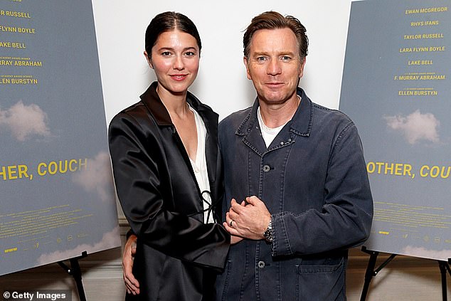 The happy couple held hands as they posed for a series of photos at the screening of the upcoming feature film.