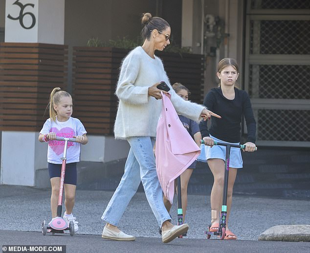 Ivy Mae, nine, Indi Rae, eight, and Isla Rose, five, played on scooters while their parents followed them.