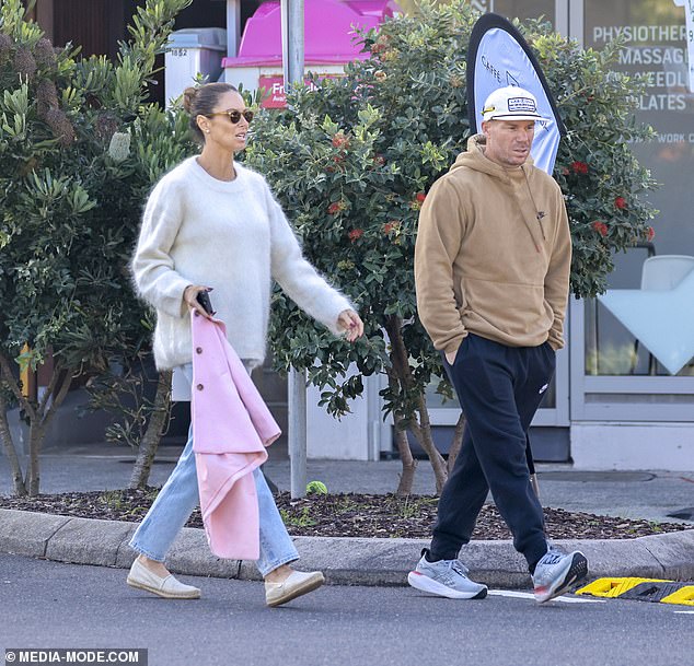 Candice, 39, stayed warm in Sydney's winter weather in a fluffy white wool jumper.