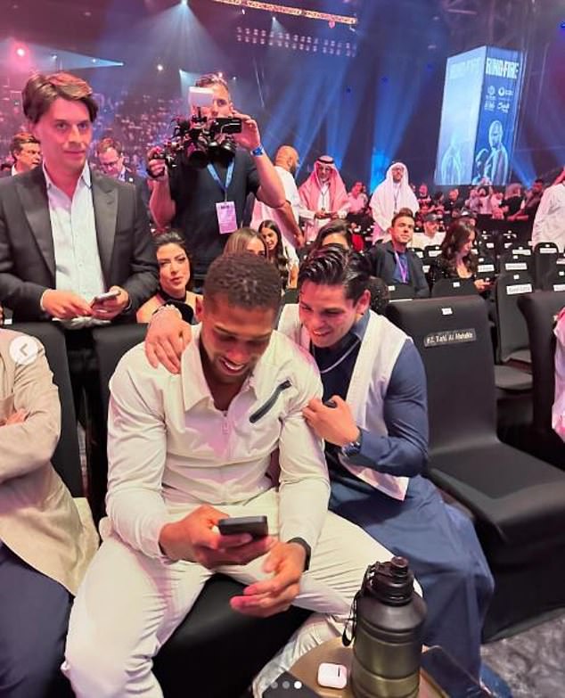 Fellow boxer Anthony Joshua was also sitting in the ring for the heavyweight title fight.