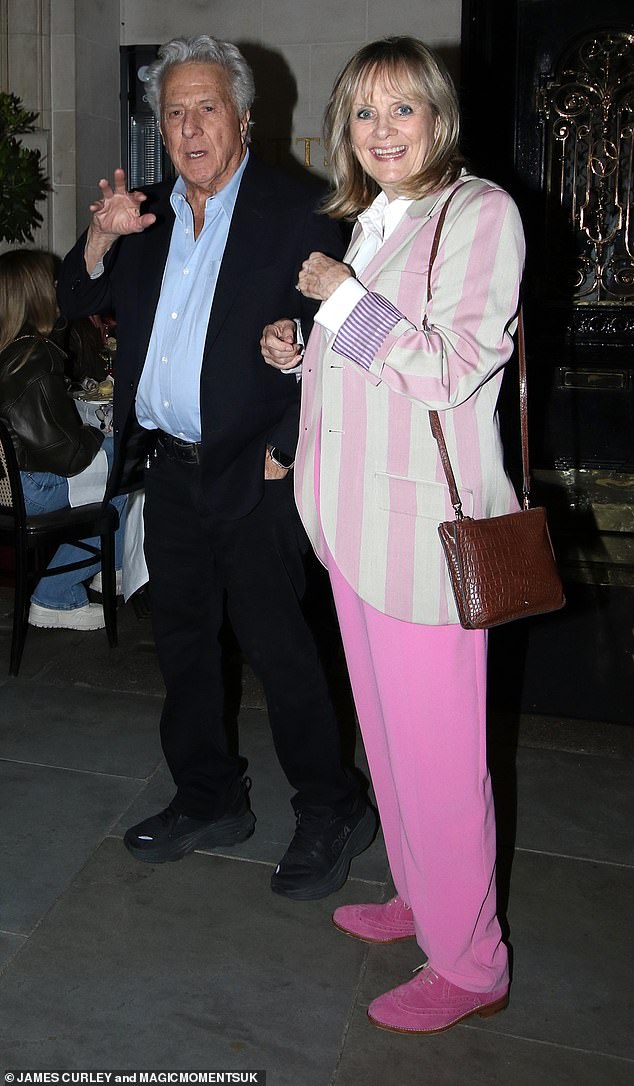 Model Twiggy looked chic as she opted for a pink ensemble for the double date, sporting a cream and fuchsia striped jacket over a white shirt.