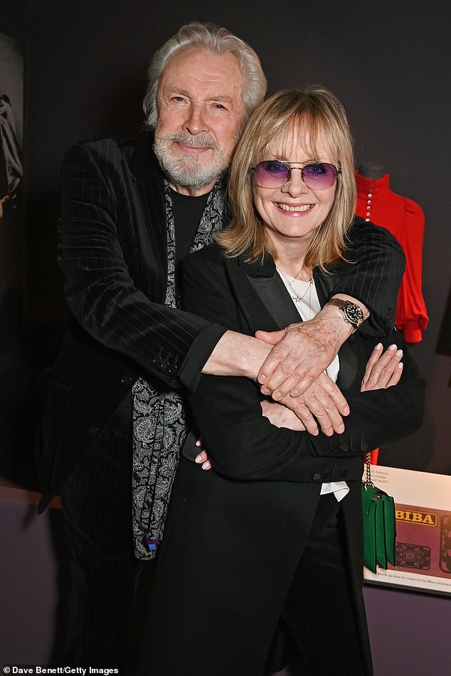 The couple put on a cozy display as Leigh, 78, hugged his wife as they posed for a photo.