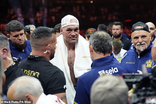 Fans suggested that John Fury, right, has been less visible and vocal following Usyk's victory.