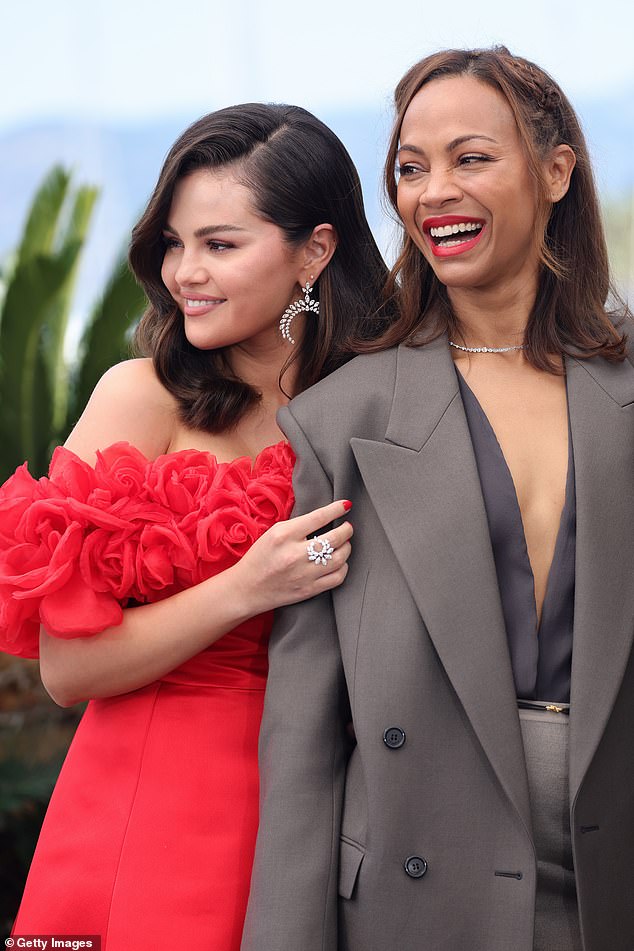 For Sunday's photocall she continued to bring glamor with a red dress with bare shoulders and ruffle details around the neckline.