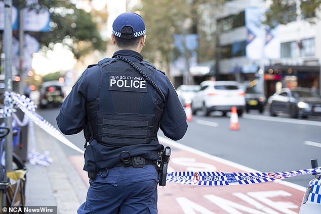 Police (pictured) have advised that there is no ongoing threat to the public and a second crime scene has been established at the intersection of Castlereagh and Park streets.