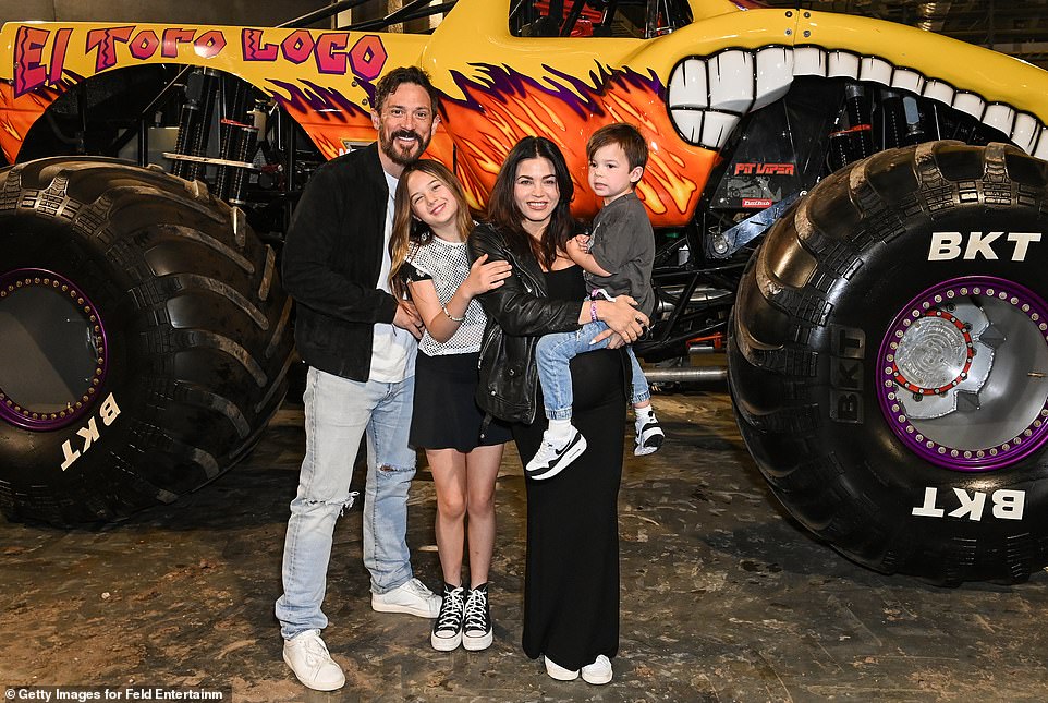 Jenna Dewan covered her growing baby bump in a flowy black dress as she posed for a photo at the star-studded event.