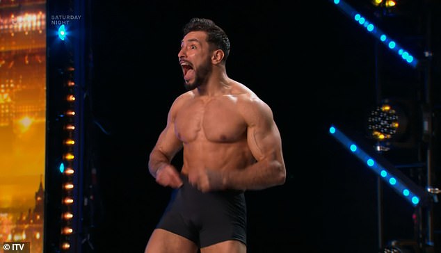 A pair of handsome men set pulses racing at the London Stadium as they stripped off every inch of their clothing apart from a pair of tight boxers emblazoned with the Union Jack flag.