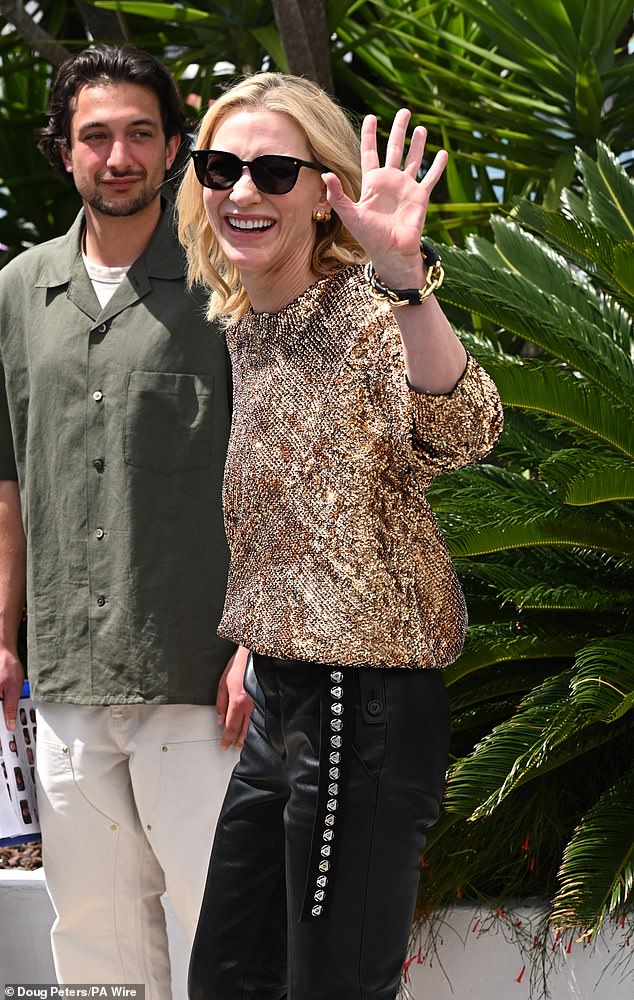 The actress also sported a pair of black sunglasses in the French sunshine as she greeted reporters.