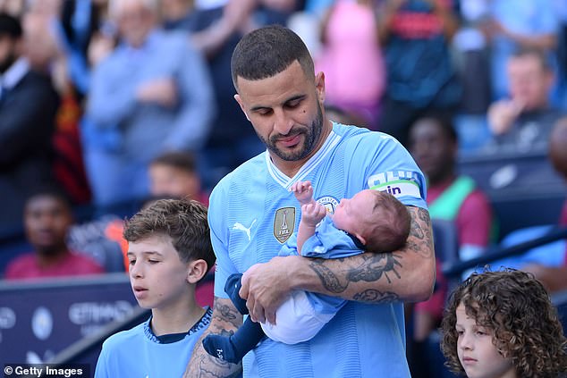 Before the game began, Kyle emerged from the tunnel with his four children, adorably cradling his baby.