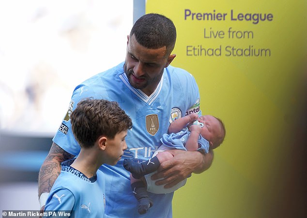 Kyle Walker emerged from the tunnel with his four children, cradling his baby Rezon, who was born last month, as he introduced him to thousands of fans.