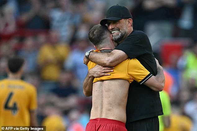 The 56-year-old German hugs Argentine midfielder Alexis Mac Allister tightly in emotional scenes at Anfield