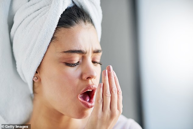 The dentist highlights that many people are not aware of their bad breath, also known as halitosis, until someone boldly points it out (file image)