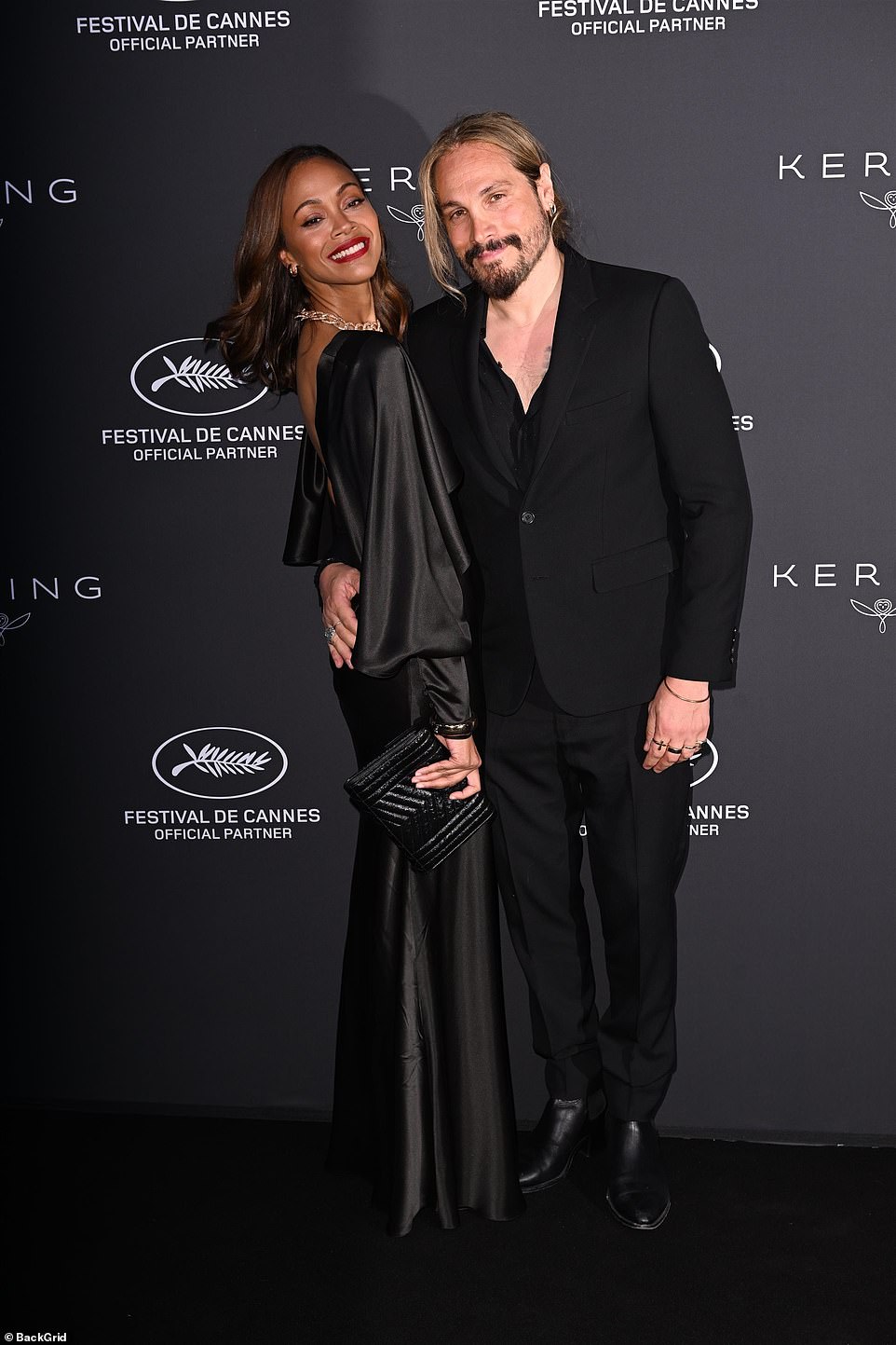 The Guardians of the Galaxy star was accompanied by her Italian husband Marco Perego-Saldaña, who looked handsome in a black suit and open-necked shirt.