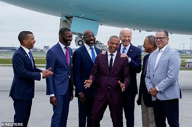 President Joe Biden arrived in Atlanta a day before Morehouse's graduation ceremony and met with prominent alumni on the track, including Senator Raphael Warnock (third from left). He put his hands on the shoulders of Marlon Kimpson, a member of the Trade Policy Advisory Committee.