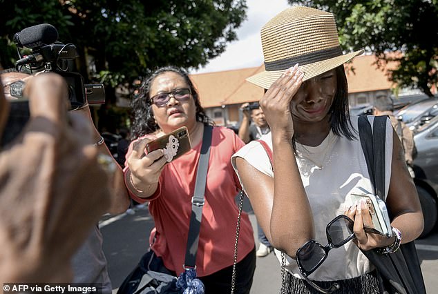 Smith had been on holiday with his wife of four months, Tracy Ijusa (pictured), when police raided their room at the Champlung Mas hotel in Legian on April 30.