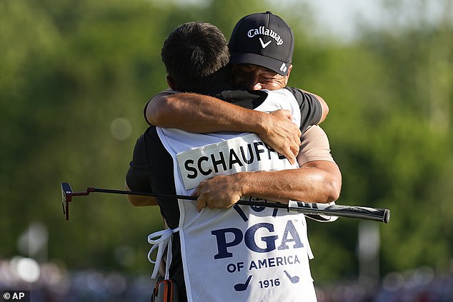 Schauffele hugged Austin Kaiser, his caddy and former teammate at San Diego State