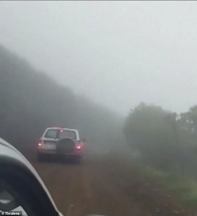 Rescuers raced through a misty rural forest where their helicopter was believed to be.