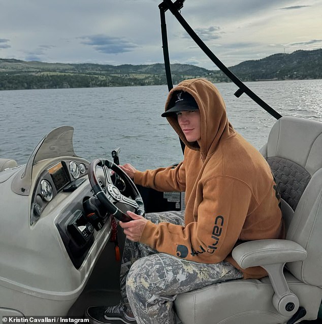 Kristin also shared photos of Mark driving the boat and lying on a bed cuddling a cute black dog.