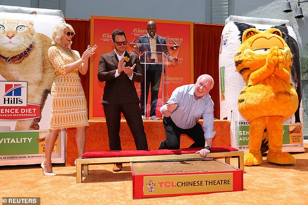 Garfield creator Jim Davis received the rare honor of putting his signature and footprints in the cement in front of the historic TCL Chinese Theater. Davis, 79, also served as an executive producer on The Garfield Movie.