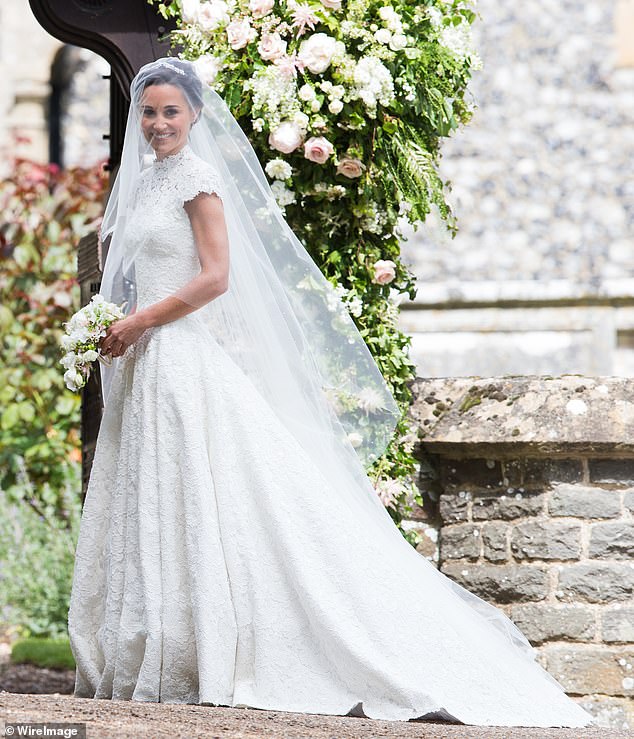 The bride wore an elaborate lace dress by British couturier Giles Deacon.