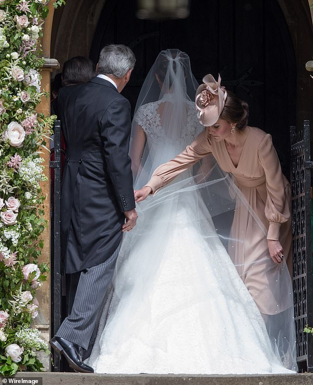 A heart-shaped keyhole on the back of Pippa's dress added a romantic touch to the look.