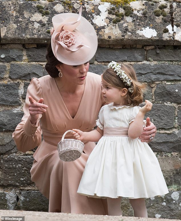 Princess Charlotte looked adorable in an ivory dress adorned with a blush pink bow.