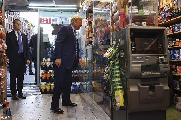 Donald Trump speaking with the owner of a Harlem bodega during a campaign stop on April 16.