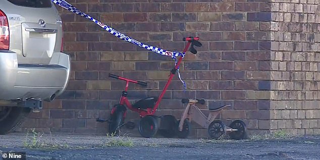 The father, known to police, is believed to have killed his son before taking his own life. Children's bicycles were seen outside the unit on Monday.