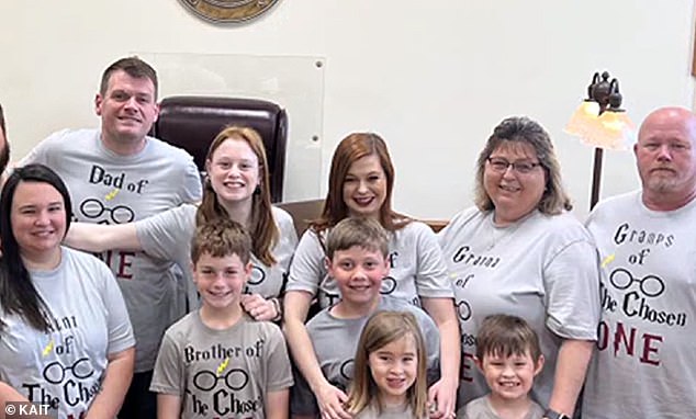 Cassie (in the middle with Luke) was touched by the reaction of her 14 family members and Luke's classmates when they witnessed the special moment.