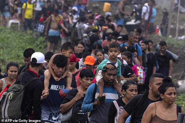 Migrants arrive in the village of Bajo Chiquito in Panama, part of an exodus through Central America, Mexico and the United States.