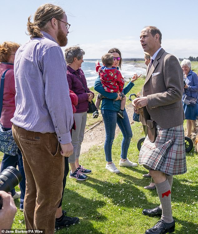 Edward looked cheerful as he chatted to members of the local Golspie community on the shore.