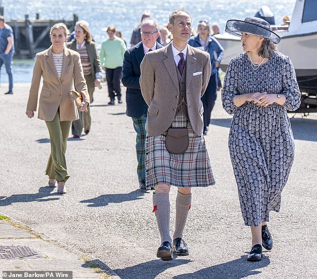 The Duke took the lead and walked with Golspie Community Council President Henrietta Marriott (right) at the front of the group.